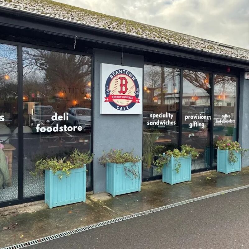 The Grange Road shopfront with turquoise planters and the Beantown sign